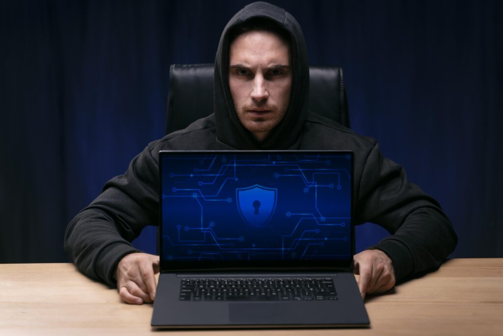 medium shot programmer with laptop